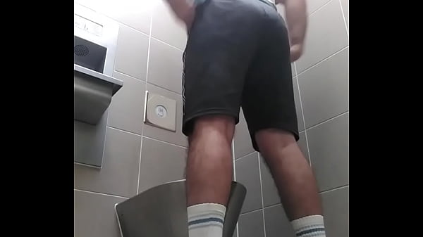 Download Video - A guy with a shapely ass pees and farts in a public toilet