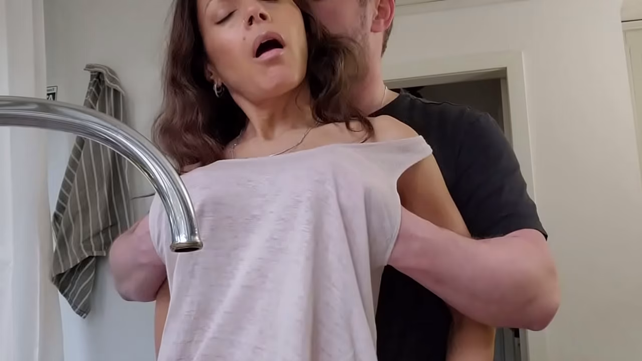 Horny wife gets fucked in the kitchen while doing the dishes