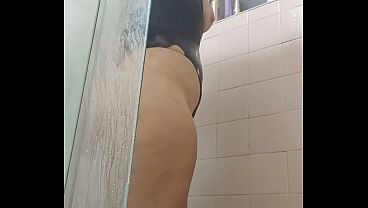 Conservative married woman secretly recording a video in the shower.