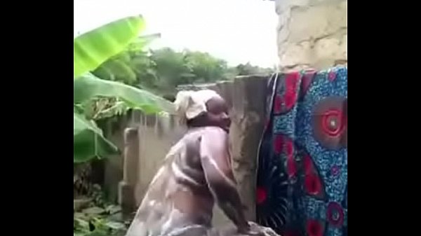 african woman washes in front of her cam