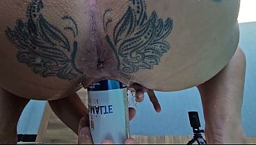 Brave girl puts a can in her tight vagina.