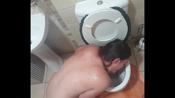 Human toilet drinks piss and licks dildo dipped in toilet