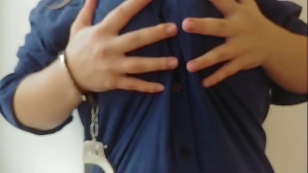 Handcuffed MILF touches her big tits