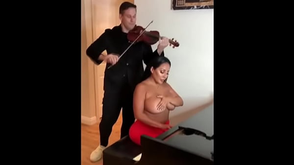 Teaching the busty lady to play the piano