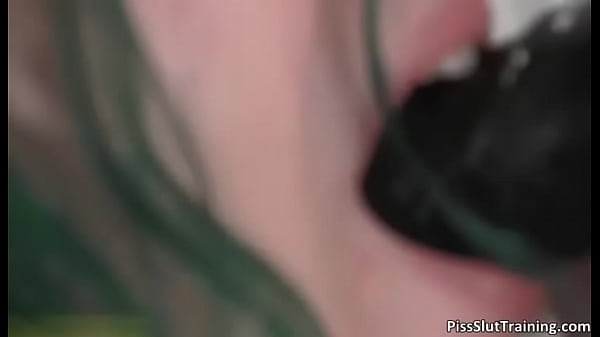 Nasty brunette babe sucks a huge dildo