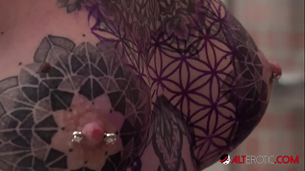 Sascha plays with Amber Luke while she gets tattooed