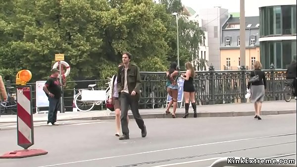 Busty naked slut handcuffed in public