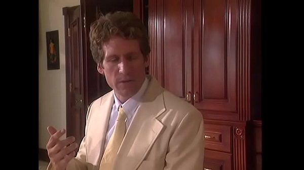 Download Video - Guy fucks a curly-haired blonde with big boobs on white sheets of doggy style