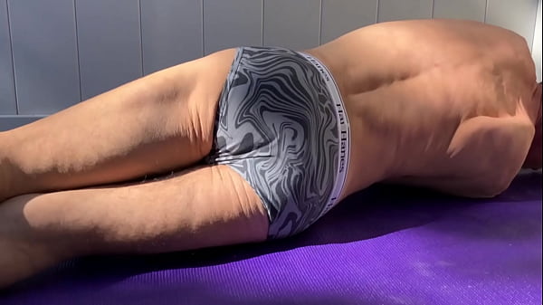 Strip and Stretch on Patio in tight briefs with Purple Balls and Mat