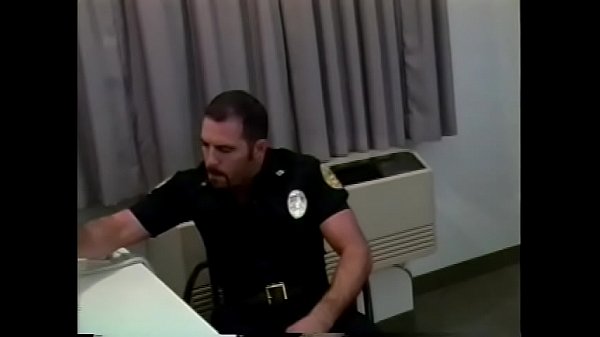 Manly cop fucks a horny gay stud in his office