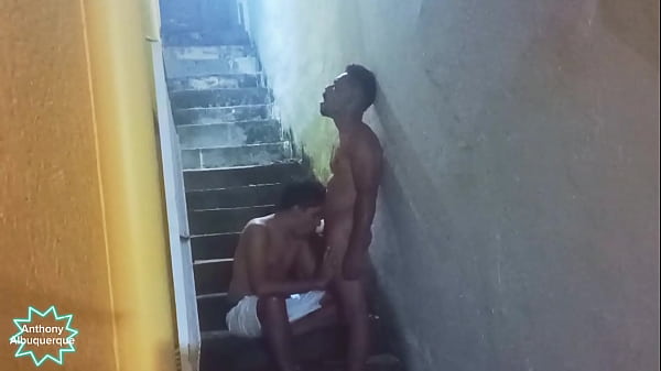 Two big dicked guys fucking on the stairs of the favela complete in Red