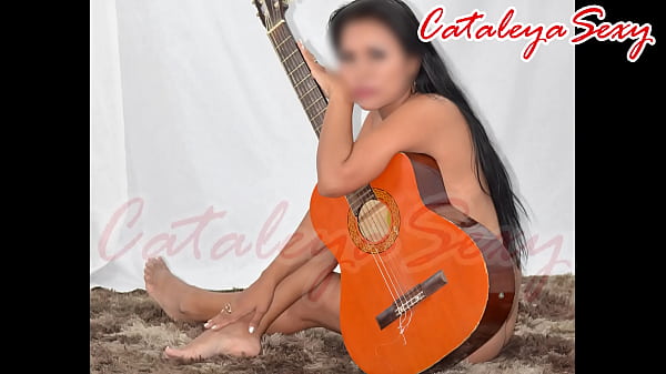 Model posing in different outfits and naked with a guitar. Really sensual.