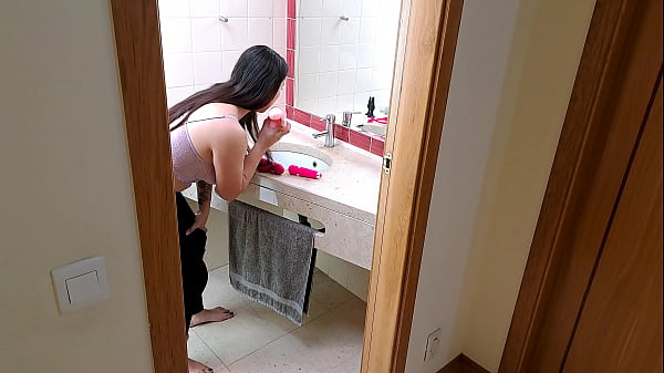 Stepsister receives facial cumshot through a hole in the sink