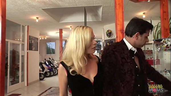 Biker milf gets a discount by sucking off the store manager in a wild orgy