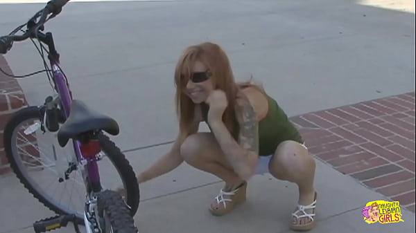 Inked blonde muff diver seduces the wandering cyclist into using a double ended dildo