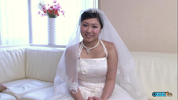 Download Video - The new asian wife is still dressed in her wedding gown when someone visited her