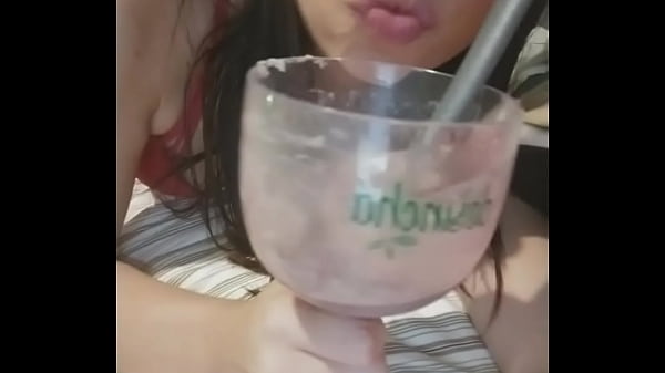 Hot babe with glass in hand shakes the horseradish