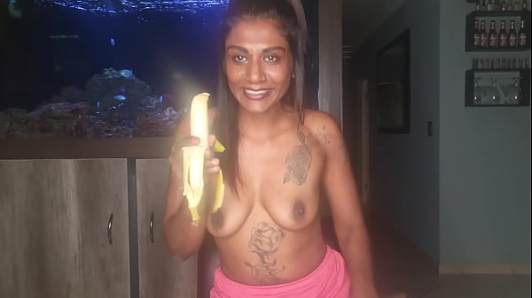 Topless desi squeezes her boobs as she sucks and deepthroats on a banana