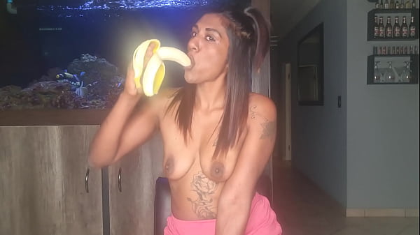 Topless desi squeezes her boobs as she sucks and deepthroats on a banana