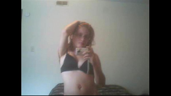 redhead Lily Cooper caressing her soft body in front of the mirror