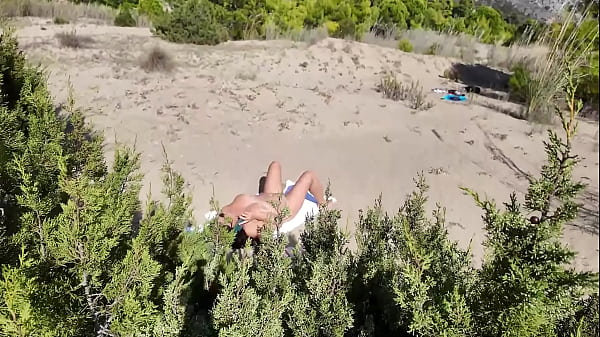 Stranger on a Nudist Beach