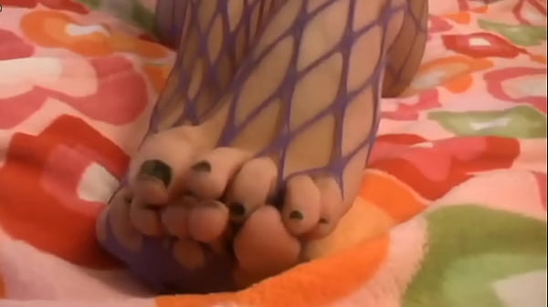 Chick in fishnets toying her pussy hole