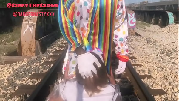 Clown almost gets hit by train while getting head